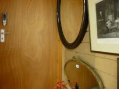 Gilt framed oval bevelled glass wall mirror and a similar larger timber framed mirror