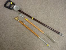 Vintage shooting stick and two decorative shoe horns