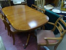 Antique style crossbanded mahogany twin pedestal dining table and six (four plus two) Sheraton style