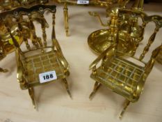Pair of ornamental brass rocking chairs