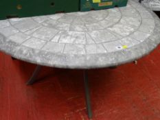 Circular stone effect garden table on metal supports
