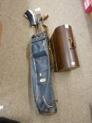 Cased Singer sewing machine and a bag of vintage golf clubs