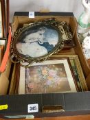 Metallic scrolled oval portrait frame and other prints