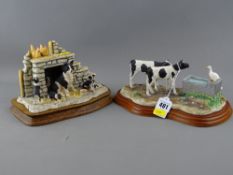 Two composite figurines of farmyard studies on wood effect bases