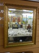 Gilt framed bevelled glass wall mirror