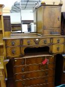 Three items of walnut mid Century bedroom furniture to include a mirrored dressing table, a five