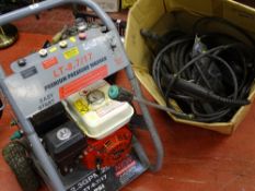Premium petrol powered pressure washer model no. LT-8.7/17 along with associated hosing, lance etc
