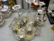 Small circular galleried electroplate tray with goblets, electroplate water jug and an epergne