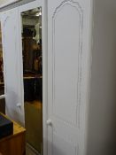 Modern white mirrored wardrobe with lower drawers