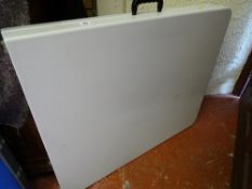 Portable plastic fold-up table