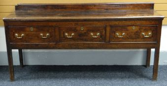 EIGHTEENTH CENTURY OAK DENBIGHSHIRE DRESSER BASE having railback super structure, the projecting top