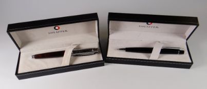 A MODERN IRIDEDCENT RED SHEAFFER 300 FOUNTAIN PEN with bright chrome cap, chrome plate trim &