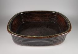DAVID LLOYD JONES STUDIO POTTERY BASIN of rounded rectangular form with ribbed exterior, potter's