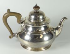 GEORGE V SILVER CIRCULAR SQUAT DESIGN TEAPOT having wooden finial & handle, Birmingham 1922, 18 troy