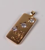 YELLOW METAL ENGRAVED PENDANT SET WITH THREE DIAMONDS (02.5cts overall visual estimate) 3.9grams