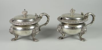 A PAIR OF HEAVY SILVER LIDDED BALUSTER POTS OR SALTS with scroll handle, raised on three lion mask &