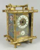 EARLY TWENTIETH CENTURY BRASS BAMBOO DESIGN CARRIAGE CLOCK the front & side panels decorated with