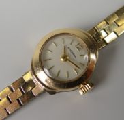 LADIES RODANIA 9CT GOLD WRIST WATCH on 9ct gold strap, 14.8grams approx.