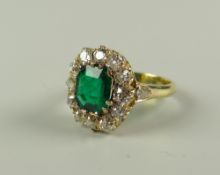 AN 18CT GOLD & DIAMOND CLUSTER RING the central emerald surrounded by twelve diamonds with two
