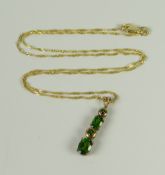 A 9CT YELLOW GOLD FINE NECKLACE ON PROBABLY DIOPSIDE PENDANT, 2.3grams approx.
