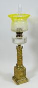 A UNUSUAL ANTIQUE OIL LAMP the base in the form of a deteriorating Roman-period two-section column