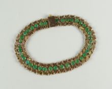 A 14K GOLD EMERALD SET LADIES BRACELET, 8.9grams approx.