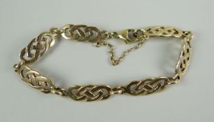 A 9CT GOLD LADIES CELTIC DESIGN BRACELET, 13.6grams approx.