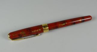 A MODERN RED CHINESE LAQUE PARKER SONNET (FRANCE) ROLLER BALL WITH GOLD TRIM