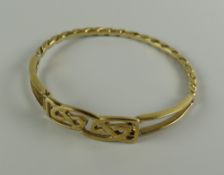 A 9CT GOLD LADIES CELTIC & TWIST DESIGN BANGLE, 13.4grams approx.