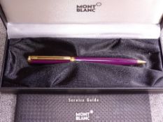 A PURPLE MONTBLANC NOBLESSE OBLIGE BALLPOINT PEN