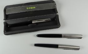 A MODERN BLACK PARKER FRONTIER FOUNTAIN PEN with stainless steel cap together with two vintage black