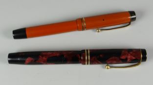 TWO VINTAGE PARKER DUOFOLD FOUNTAIN PENS with gold trim (1 x red, 1 x red & black marbled)