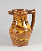 A MARBLED SLIPWARE PUZZLE JUG bearing gentlemen's drinking verse, floral incised to the neck and