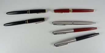 TWO VINTAGE BOXED BLACK PARKER DUOFOLD JUNIOR FOUNTAIN PENS with gold trim, cap buttons missing /