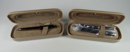 A MODERN GUNMETAL PLATE SHEAFFER PRELUDE BALLPOINT PEN with black trim, in original box with