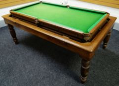 A GEORGE EDWARDS OF LONDON OAK ROLL OVER SNOOKER / DINING TABLE on turned corner supports together