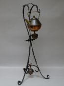 AN ARTS & CRAFTS CHRISTOPHER DRESSER COPPER & BRASS SPIRIT KETTLE on a wrought iron stand with