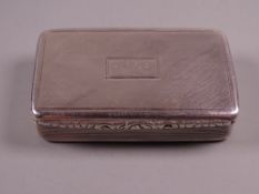 A HEAVY OBLONG SILVER SNUFF BOX, the hinged lid having scrolled decoration to the front edge and