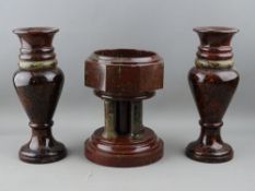 A VICTORIAN CORNISH SERPENTINE STONE FONT and a pair of baluster vases, 18.5 cms and 22.5 cms high