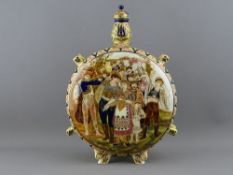 A ZSOLNAY PILGRIM KULAC (FLASK), moon shaped with panels depicting wedding and grape harvesting