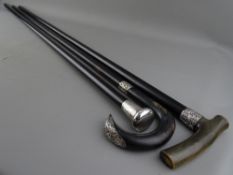 THREE EBONY/EBONIZED SILVER MOUNTED WALKING CANES, 92 cms the longest