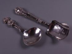 A HEAVY SILVER CADDY SPOON marked 'The Lincoln Imp', 1 troy oz, London 1917 and a caddy spoon with
