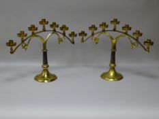 A GOOD PAIR OF VINTAGE BRASS ALTAR CANDELABRA, the circular bases with memorial inscription for
