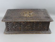 A NEAT HEAVILY CARVED OAK BIBLE BOX, 13 cms high, 41 cms wide, 23 cms deep