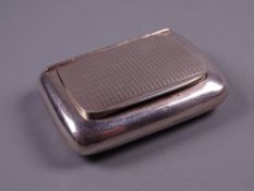 AN OBLONG SILVER SNUFF BOX with engine turned hinged lid, Birmingham 1930 by Charles Usher