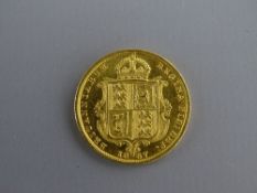 AN 1887 GOLD HALF SOVEREIGN, 4 grms