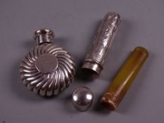 A TINY MOON SHAPED SILVER FLASK, the body of swirled form and with hinged lid, London 1890 by