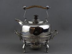 A GEORGE V SILVER KETTLE ON STAND, Birmingham 1910, 24 cms high overall, 16 cms diameter the kettle,
