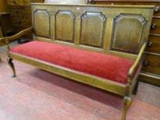 A WELL COLOURED GEORGE III OAK OPEN SETTLE, the back with four shaped and crossbanded panels with