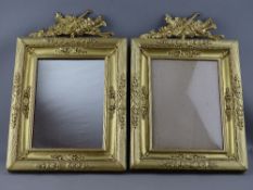 A PAIR OF GILDED BRASS EASEL PORTRAIT FRAMES/MIRROR having reeded and garland decoration with